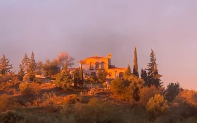 Villa Morisco for the women's retreat nestled in the hilly landscape of Málaga in the golden light of the sunset.